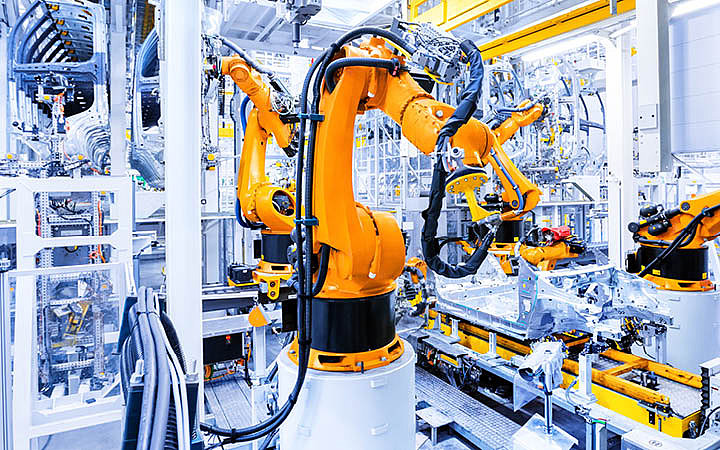 LED luminaires in production line with robots